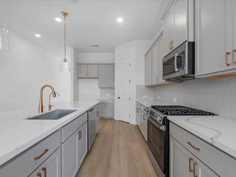 Kitchen. Sample product photo. Actual exterior and interior selections may vary by homesite. Photo may be virtually staged.