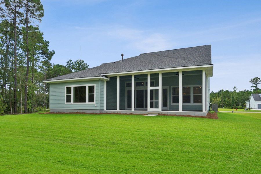 Exterior details and patio area of a home in Hidden Ponds Reserve, Awendaw (Image 28).
