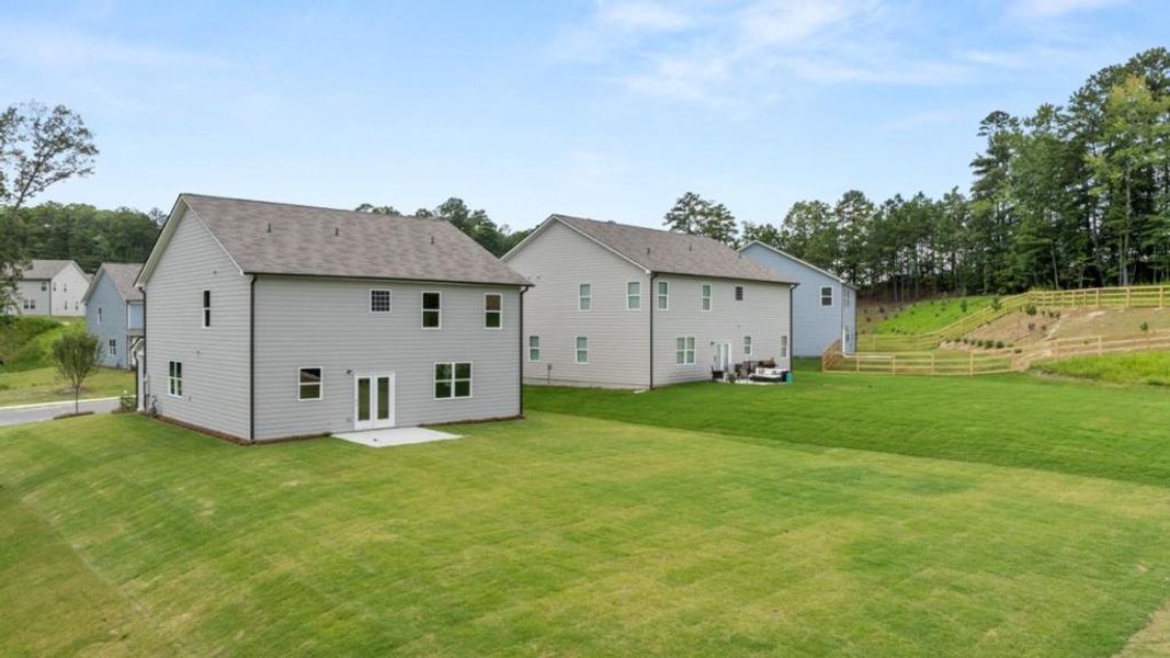Exterior details and patio area of a home in Northwoods at Mirror Lake, Villa Rica (Image 4).