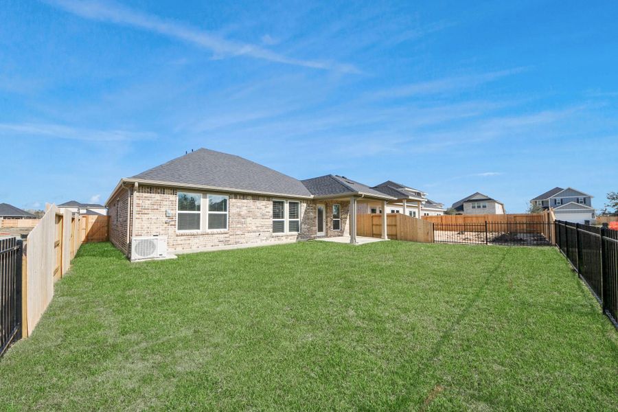 Exterior details and patio area of a home in Laurel Landing: Landmark Collection, Alvin (Image 22). Exterior details and patio area of a home in Laurel Landing: Landmark Collection, Alvin (Image 22).