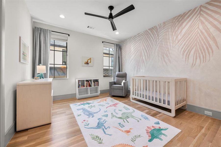 Bedroom featuring oak hardwood floors, recessed lighting, a ceiling fan, and wallpapered walls