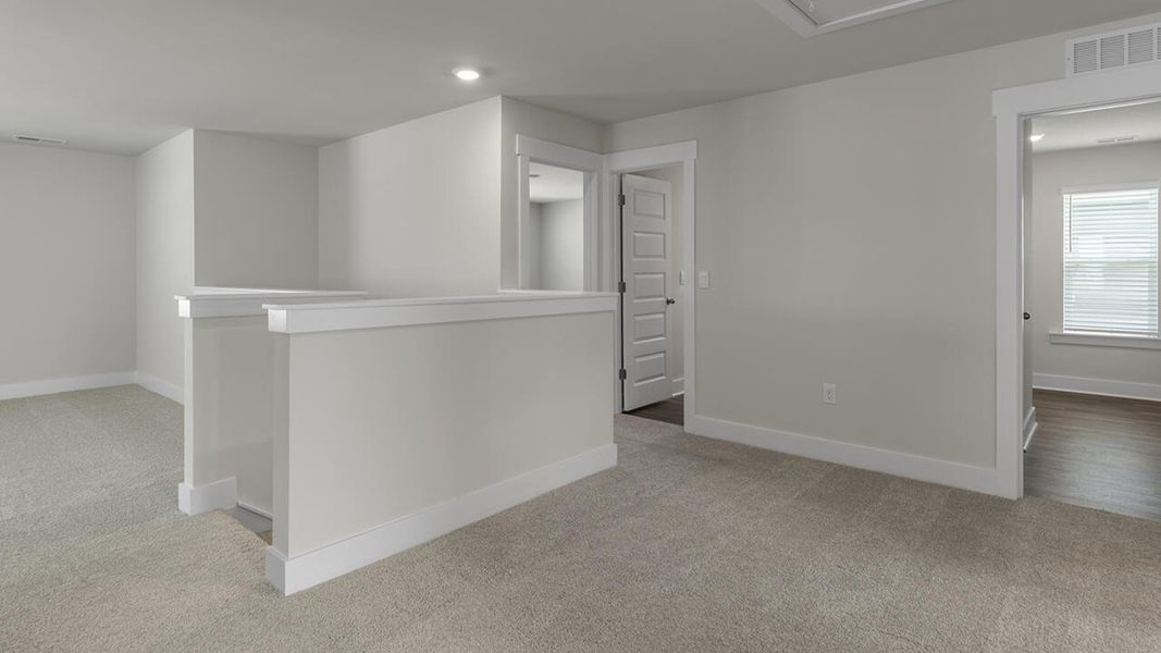 Representative unfurnished interior of a home built from the TILLMAN by D.R. Horton in The Preserve at Tidewater, Sneads Ferry (Image 32).