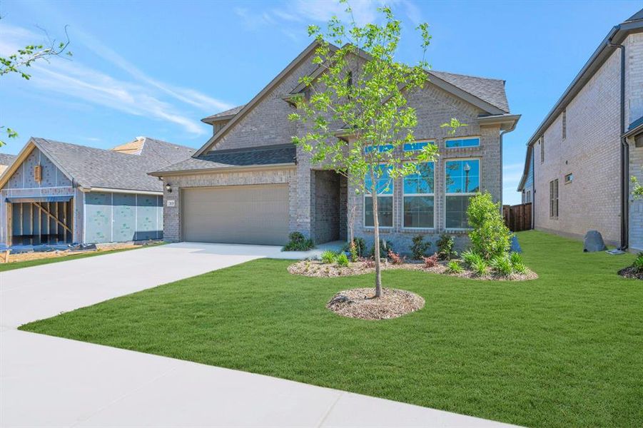 Front exterior of a new home in Vintage Village, Argyle, TX, highlighting curb appeal (Image 20).