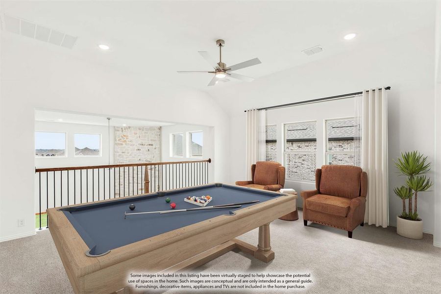 Upstairs game room with pool table, ceiling fan, carpet flooring, and open railing overlooking lower level