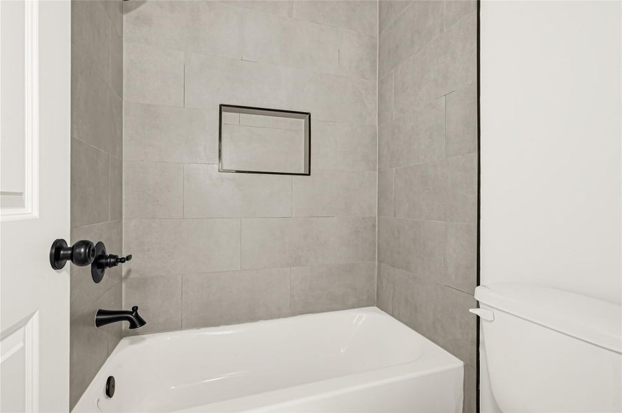 Separate shower with contemporary tile surround. Separate shower with contemporary tile surround.
