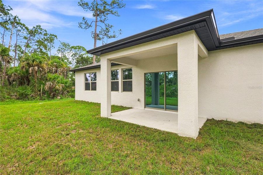 Exterior details and patio area of a home in , North Port (Image 21).
