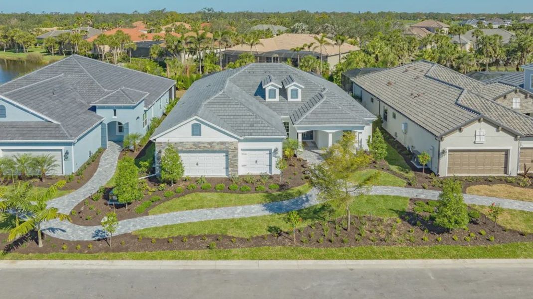 Representative exterior photo of a completed home built from the Captiva by Neal Communities in Grand Palm, Venice, FL (Image 21). Representative exterior photo of a completed home built from the Captiva by Neal Communities in Grand Palm, Venice, FL (Image 21).