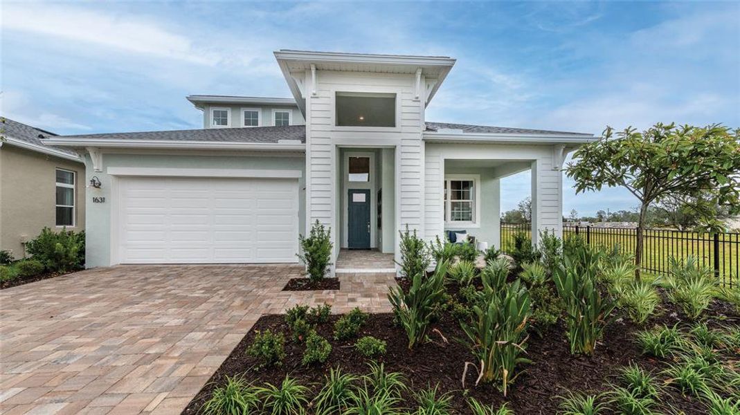 Front exterior of a new home in The Reserve at Victoria, Deland, FL, highlighting curb appeal (Image 1). Front exterior of a new home in The Reserve at Victoria, Deland, FL, highlighting curb appeal (Image 1).