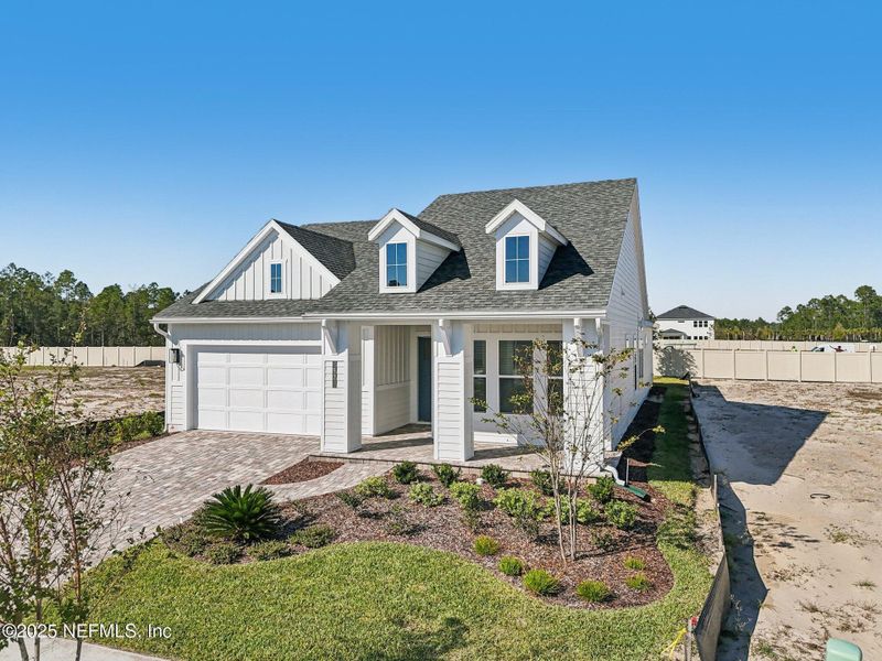 Front exterior of a new home in Seabrook Village II, Ponte Vedra, FL, highlighting curb appeal (Image 28). Front exterior of a new home in Seabrook Village II, Ponte Vedra, FL, highlighting curb appeal (Image 28).