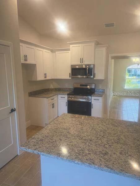 Furnished interior view inside a new home in , Port Charlotte (Image 6).