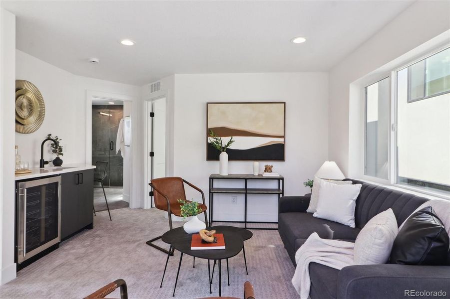 Third floor bonus room with wet bar, opening to walk out deck