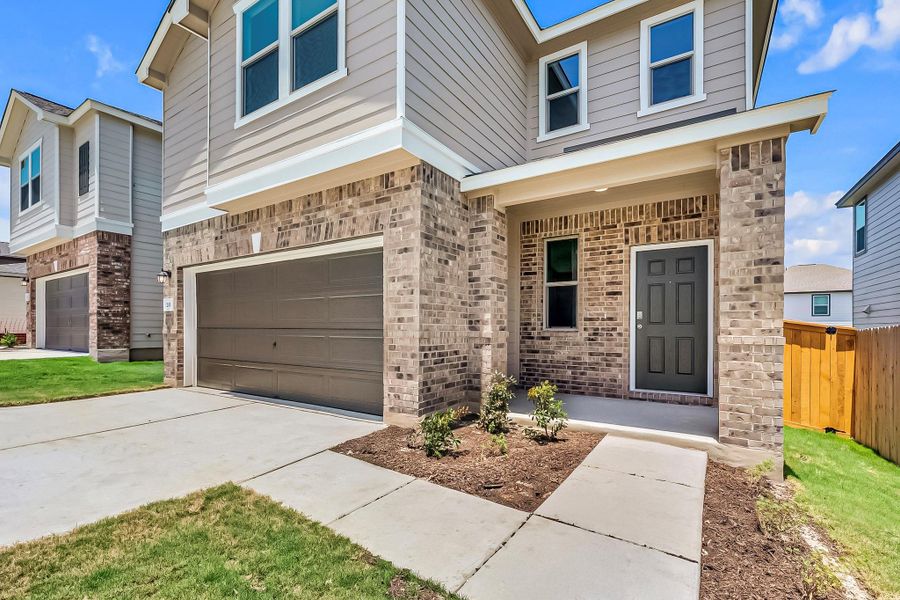 Front exterior of a new home in Sonterra - Cool Water, Jarrell, TX, highlighting curb appeal (Image 21).
