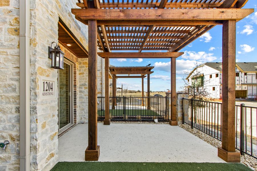 Exterior details and patio area of a home in The Tribute, The Colony (Image 27).