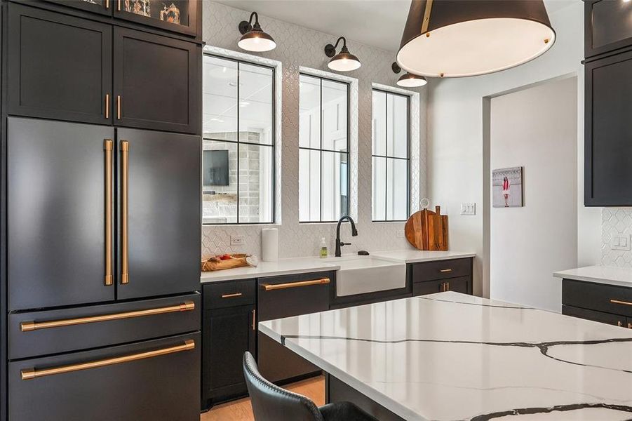 Large kitchen sink area that overlooks the pool area