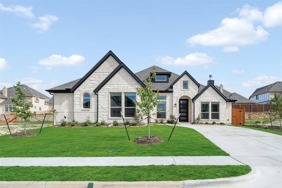 Front exterior of a new home in Villages of Walnut Grove, Midlothian, TX, highlighting curb appeal (Image 19). Front exterior of a new home in Villages of Walnut Grove, Midlothian, TX, highlighting curb appeal (Image 19).