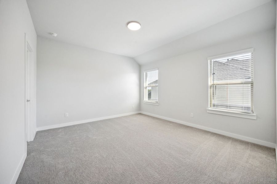 Bedroom in the Wimbledon home plan by Trophy Signature Homes – REPRESENTATIVE PHOTO
