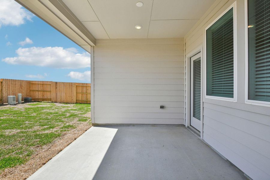 Exterior details and patio area of a home in Sanford Farms - Traditional Series, Waller (Image 26).