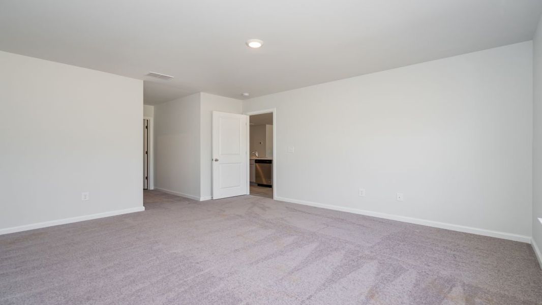 Representative unfurnished interior of a home built from the ARIA by D.R. Horton in Stanbury Creek, Supply (Image 24).