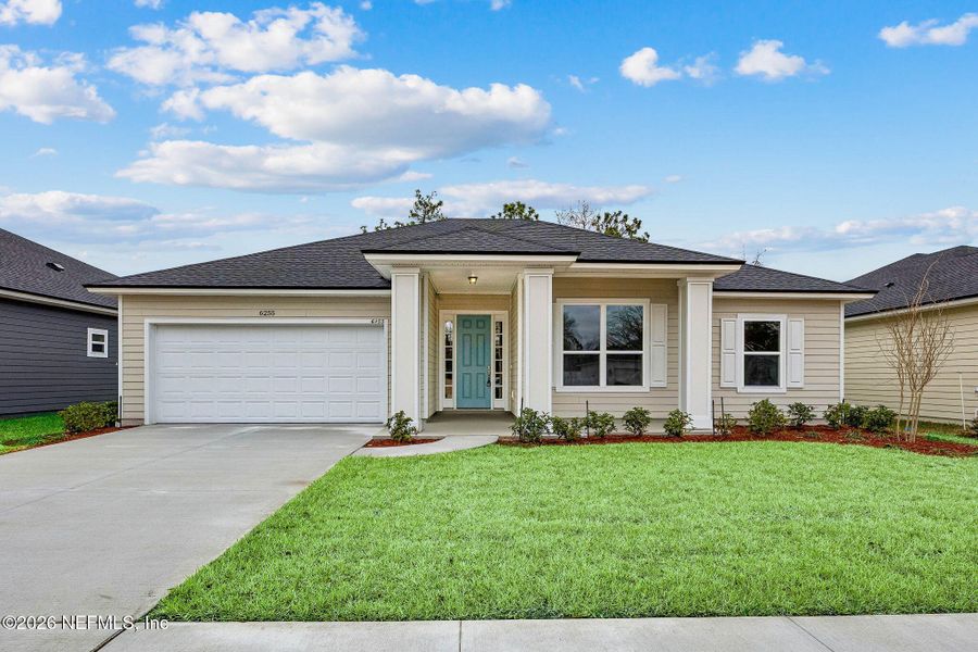 Front exterior of a new home in Weston Woods, Jacksonville, FL, highlighting curb appeal (Image 1). Front exterior of a new home in Weston Woods, Jacksonville, FL, highlighting curb appeal (Image 1).