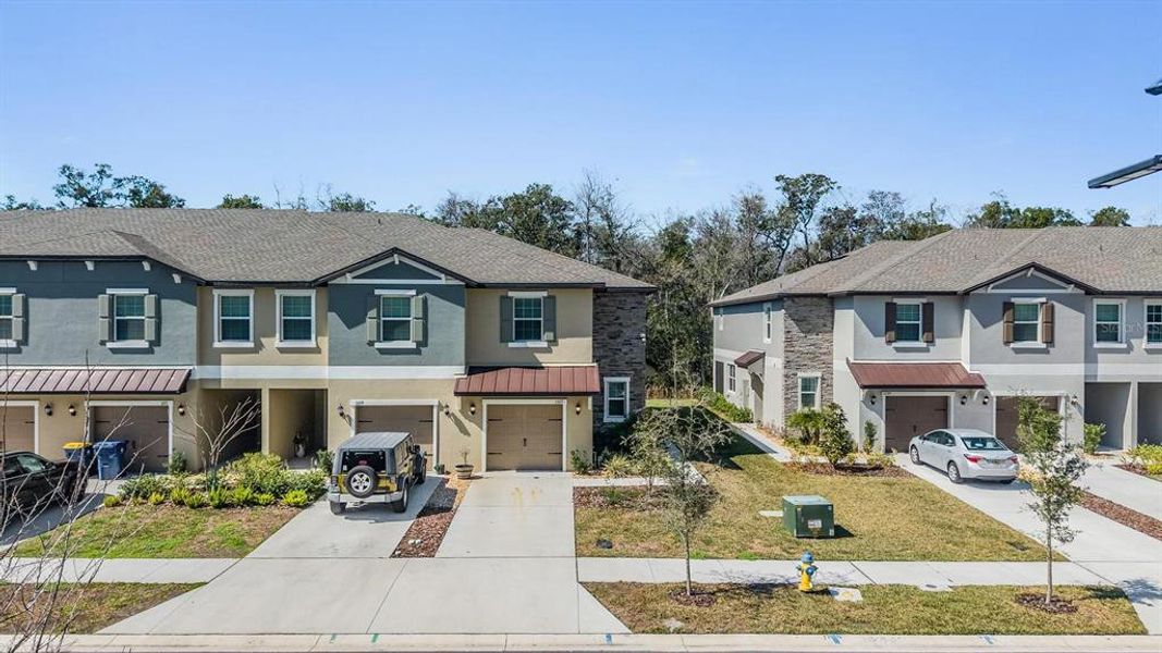 Front exterior of a new home in , Land O' Lakes, FL, highlighting curb appeal (Image 22).