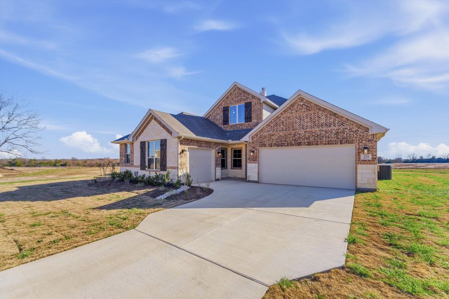 Front exterior of a new home in Fannin Ranch, Leonard, TX, highlighting curb appeal (Image 19).
