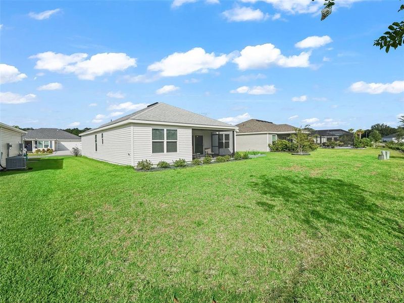 Front exterior of a new home in , The Villages, FL, highlighting curb appeal (Image 21).
