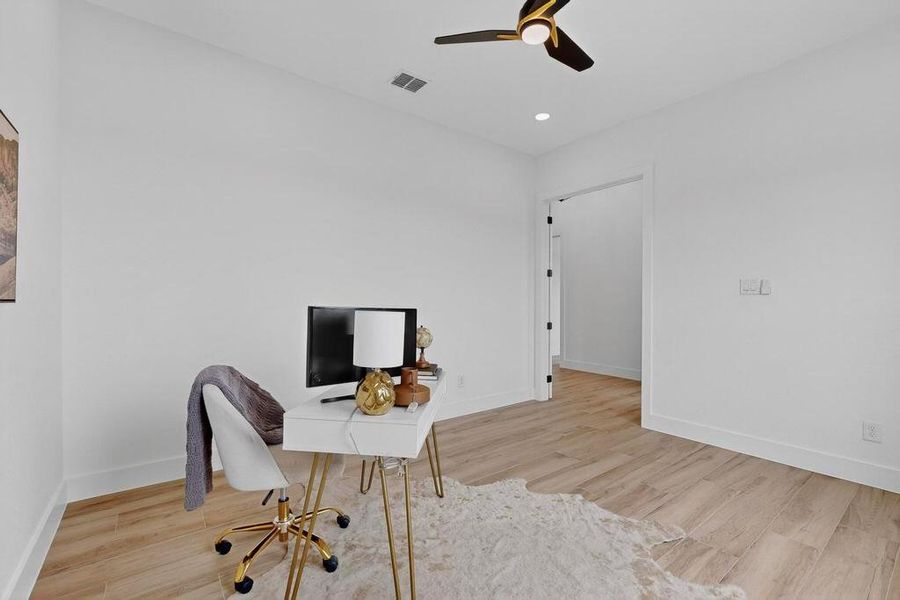 Office area with light wood-type flooring, a ceiling fan, and recessed lighting Office area with light wood-type flooring, a ceiling fan, and recessed lighting