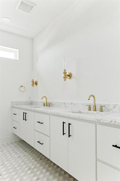 Bathroom with vanity and tile floors