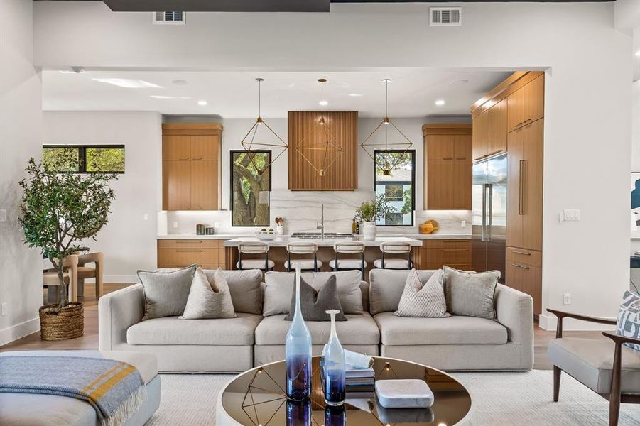 Living area featuring light wood-type flooring and recessed lighting Living area featuring light wood-type flooring and recessed lighting