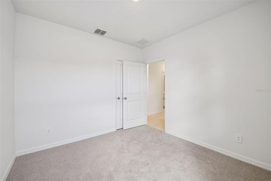 Spacious, unfurnished interior of a new home in Ridgehaven - Villas, Ormond Beach (Image 27).