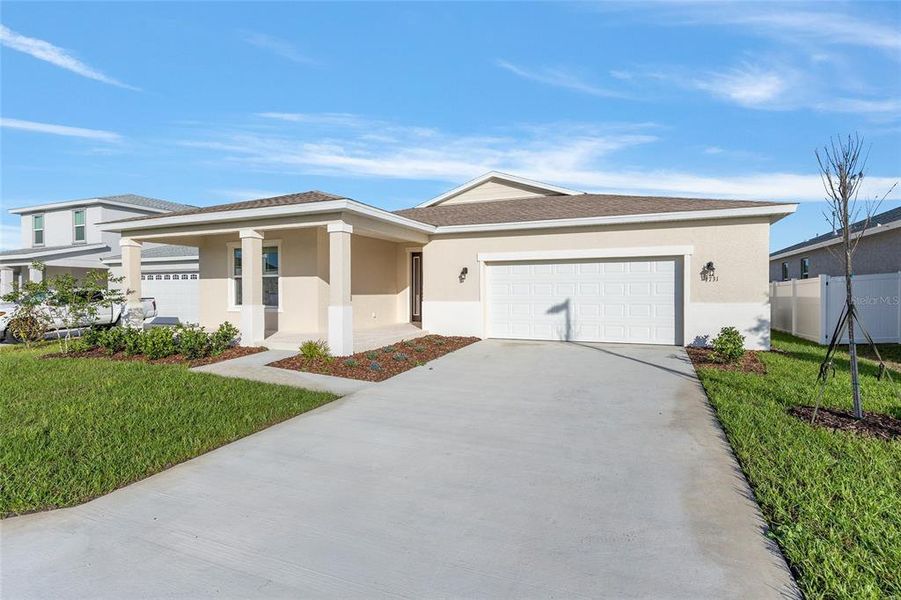 Front exterior of a new home in Calesa Township, Ocala, FL, highlighting curb appeal (Image 20). Front exterior of a new home in Calesa Township, Ocala, FL, highlighting curb appeal (Image 20).