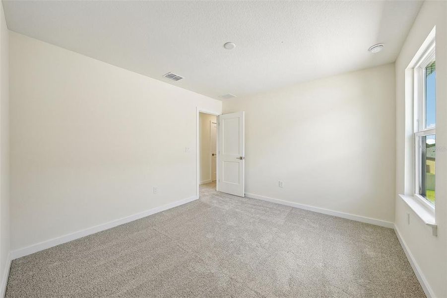 Spacious, unfurnished interior of a new home in Grasslands West, Lakeland (Image 33).