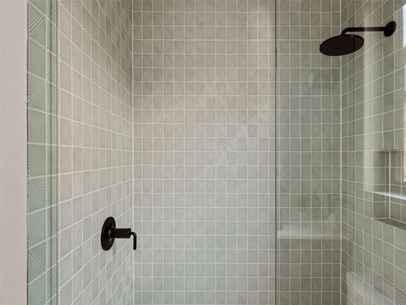 Bathroom view of a tile shower