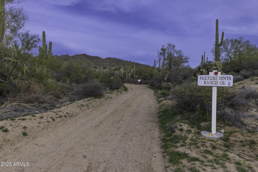Sign on Road to Property