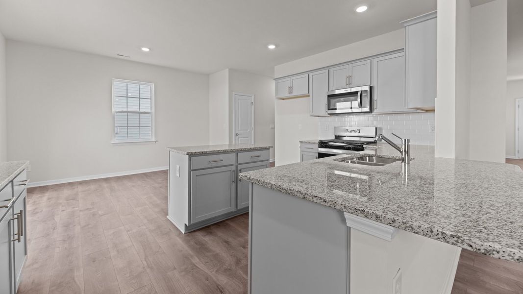 Furnished interior view inside a new home in East Ridge, Ayden (Image 4).