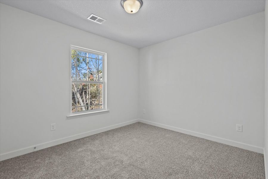 Representative unfurnished interior of a home built from the Roebuck by Enchanted Homes in Las Palomas Country Club Estates, La Vernia (Image 28).