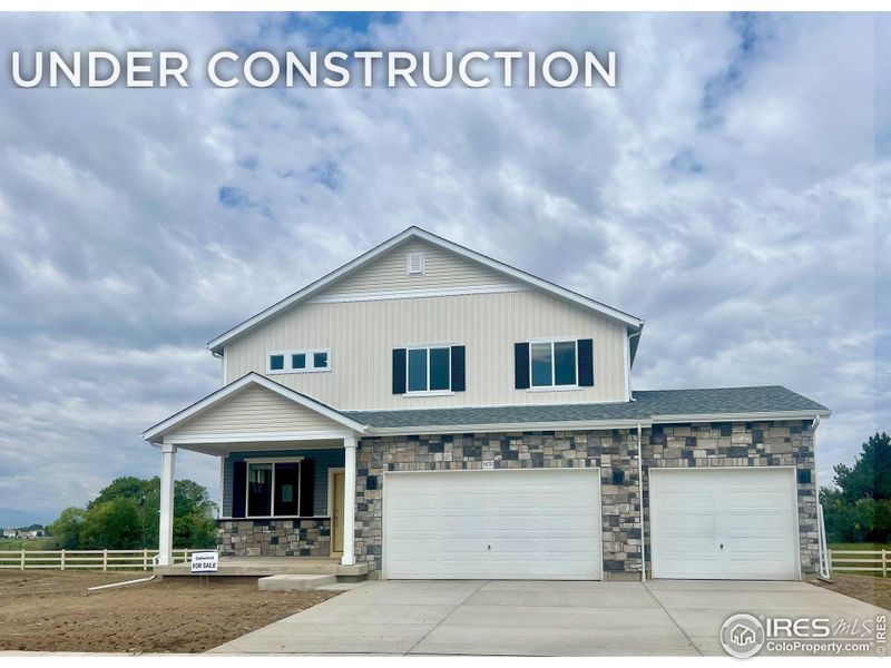 Front exterior of a new home in Thompson River Ranch, Johnstown, CO, highlighting curb appeal (Image 1).