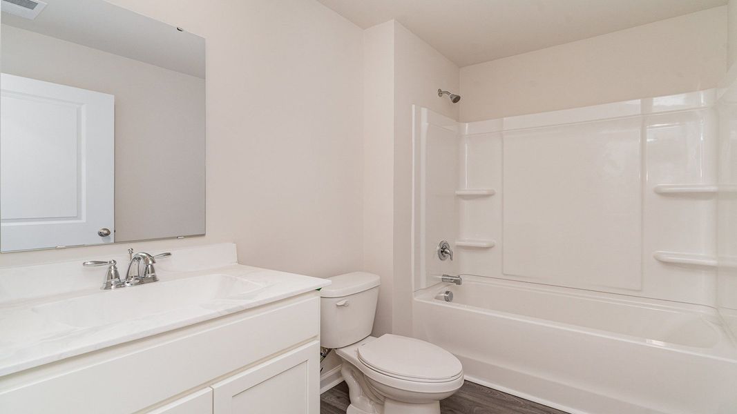 Furnished interior view inside a new home in Stanbury Creek, Supply (Image 10).