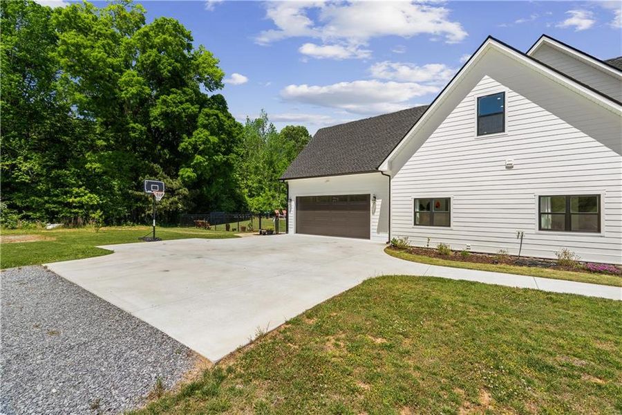 Front exterior of a new home in , Resaca, GA, highlighting curb appeal (Image 29).
