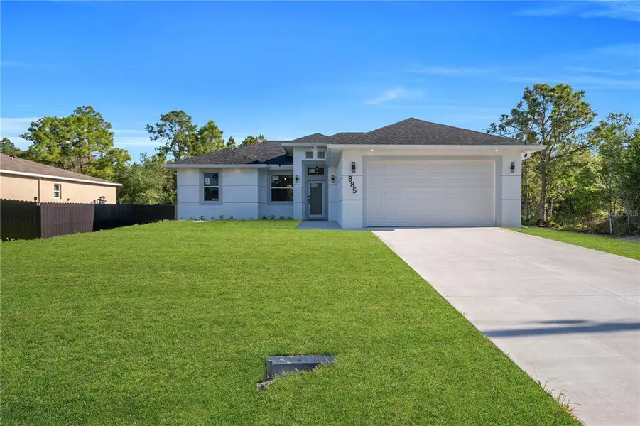 Front exterior of a new home in , Lehigh Acres, FL, highlighting curb appeal (Image 1). Front exterior of a new home in , Lehigh Acres, FL, highlighting curb appeal (Image 1).