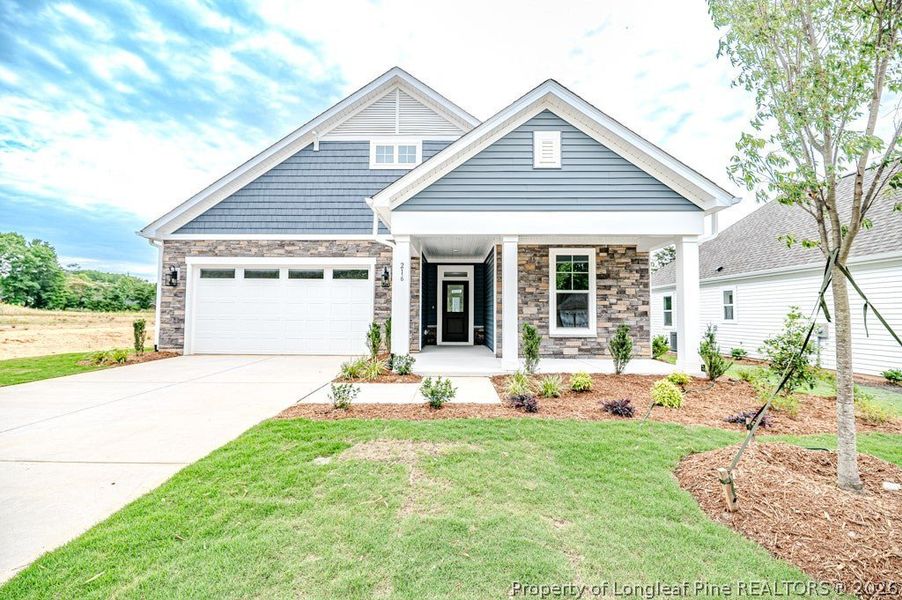 Front exterior of a new home in The Cottages at 78 North, Sanford, NC, highlighting curb appeal (Image 1). Front exterior of a new home in The Cottages at 78 North, Sanford, NC, highlighting curb appeal (Image 1).
