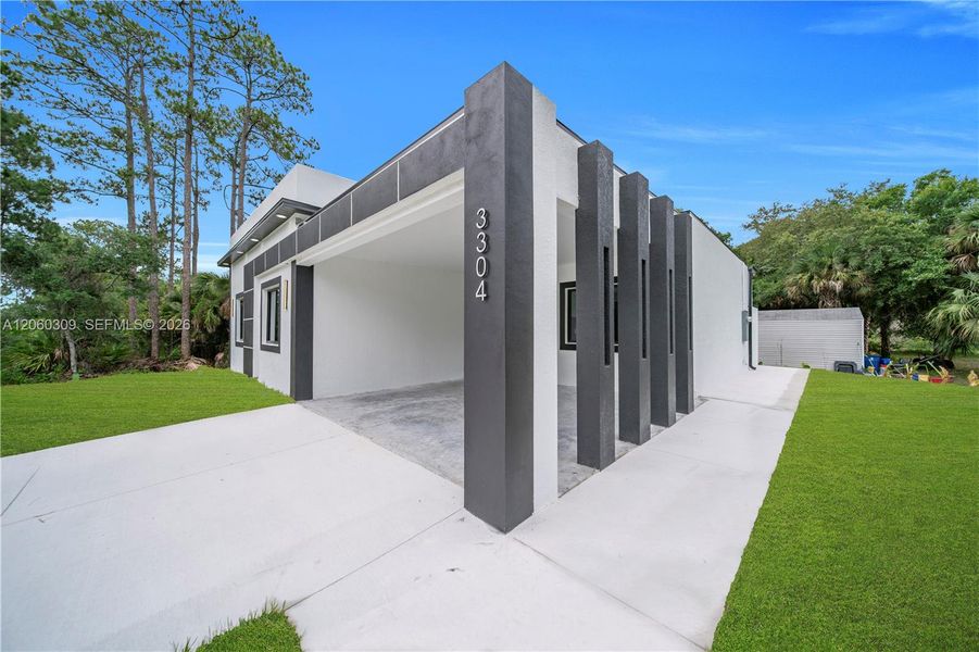 Exterior details and patio area of a home in , Lehigh Acres (Image 3).