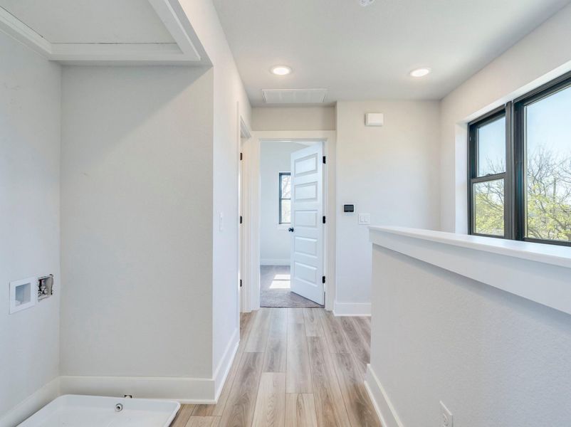 Upstairs' hallway with laundry closet/connections