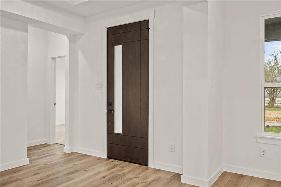 Entryway with light hardwood / wood-style flooring