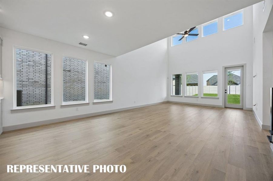 Conveniently located between the kitchen and family room, this light filled dining room is the ideal space for hosting lively dinner parties or cozy family get togethers.  REPRESENTATIVE PHOTO