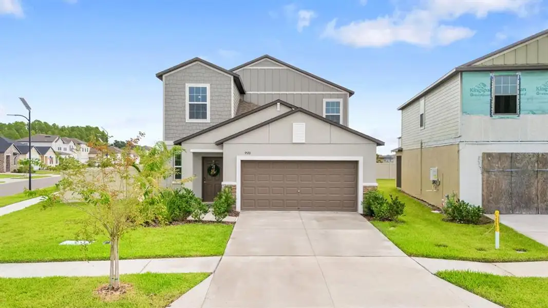 Front exterior of a new home in , Land O' Lakes, FL, highlighting curb appeal (Image 2). Front exterior of a new home in , Land O' Lakes, FL, highlighting curb appeal (Image 2).