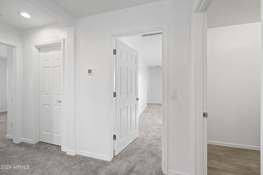 Looking into main bedroom and laundry