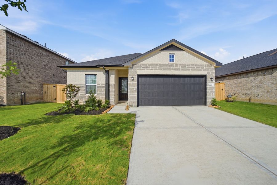 Front exterior of a new home in Ashland, Texas City, TX, highlighting curb appeal (Image 19). Front exterior of a new home in Ashland, Texas City, TX, highlighting curb appeal (Image 19).