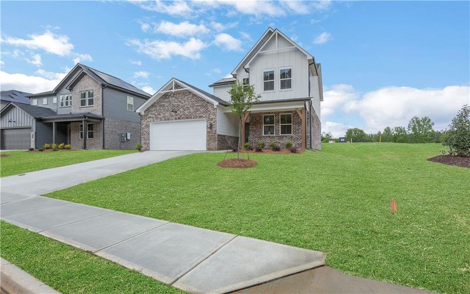 Front exterior of a new home in Easton Walk, Lawrenceville, GA, highlighting curb appeal (Image 21).