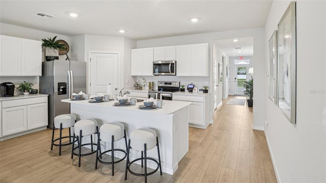 Furnished interior view inside a new home in Seagrass - Express & Tradition, Punta Gorda (Image 13). Furnished interior view inside a new home in Seagrass - Express & Tradition, Punta Gorda (Image 13).